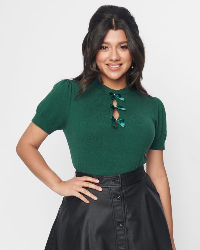Front of a model wearing a size 3X Unique Vintage Emerald Satin Bow Cutout Sweater in Green by Unique Vintage. | dia_product_style_image_id:315207